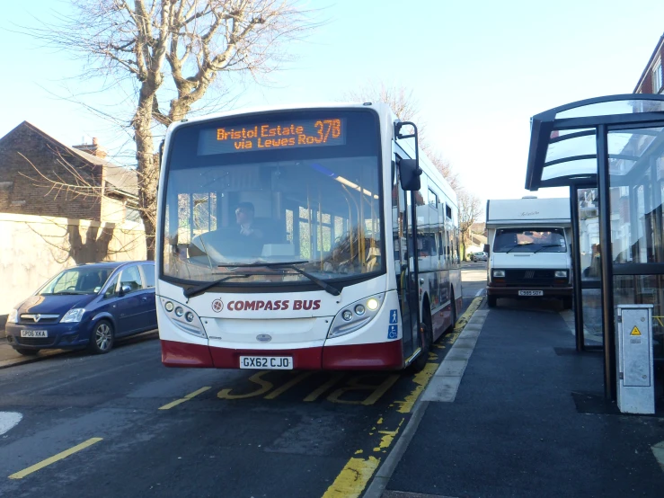 a public transit bus parked on the side of the road