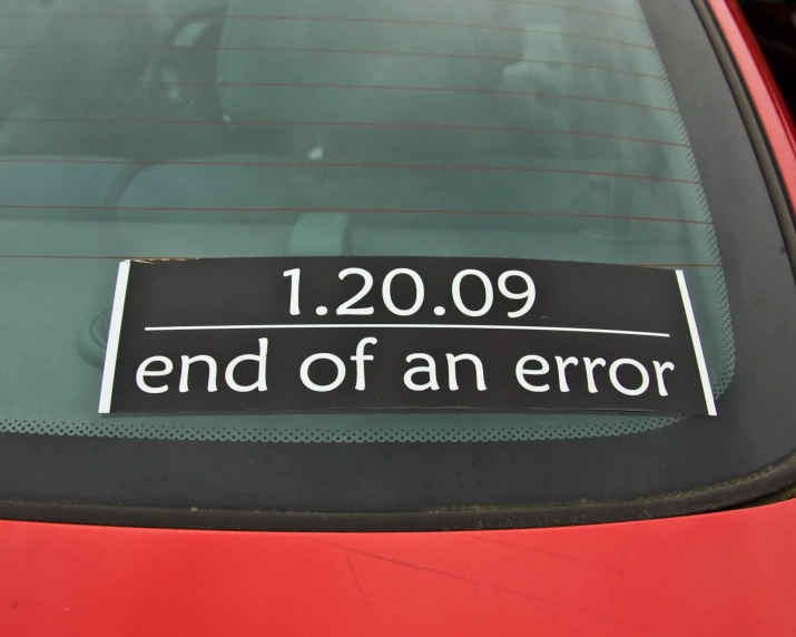 a sticker that has been placed on a car's windshield to show the end of an error