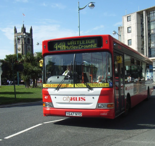 a public bus driving on a city street