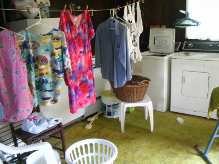clothing on the line in a messy kitchen