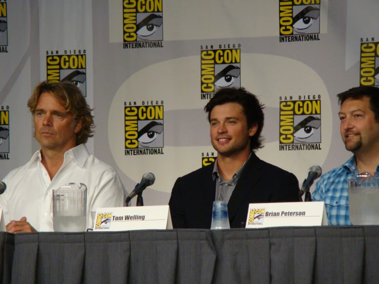 actors on stage at convention having some laughs