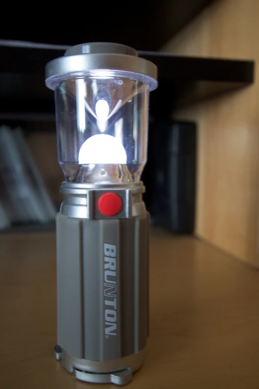 a small lighted device sits on a table