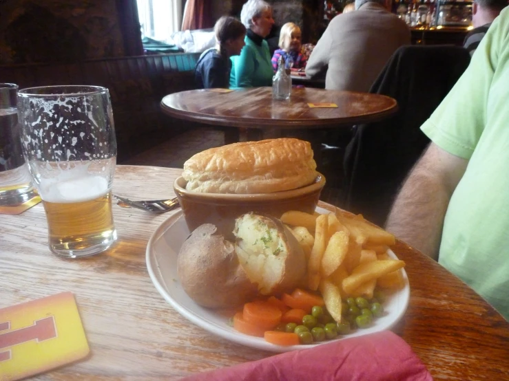 a meal with beer and bread on a table