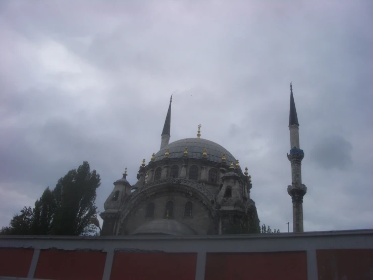 large building on cloudy day with blue sky