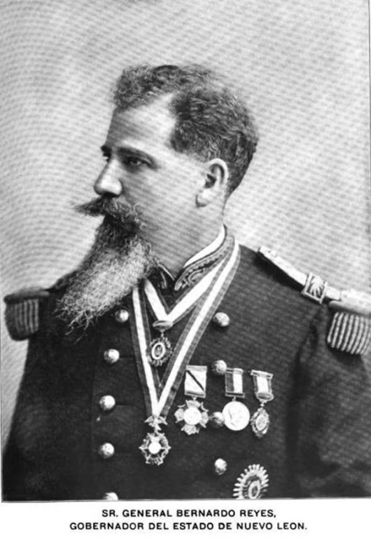 an old po of a man with a mustache wearing a uniform and medal