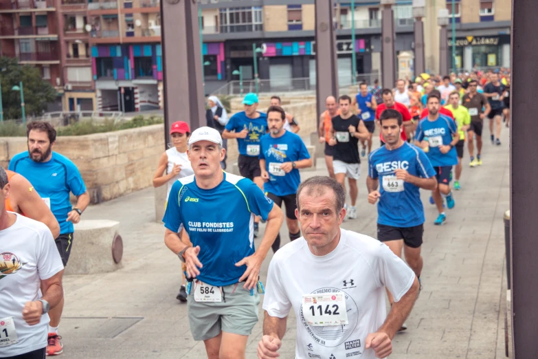 a group of people running in a marathon