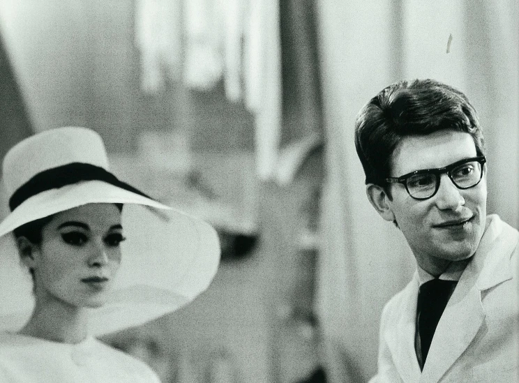 a man and a woman posing in hats