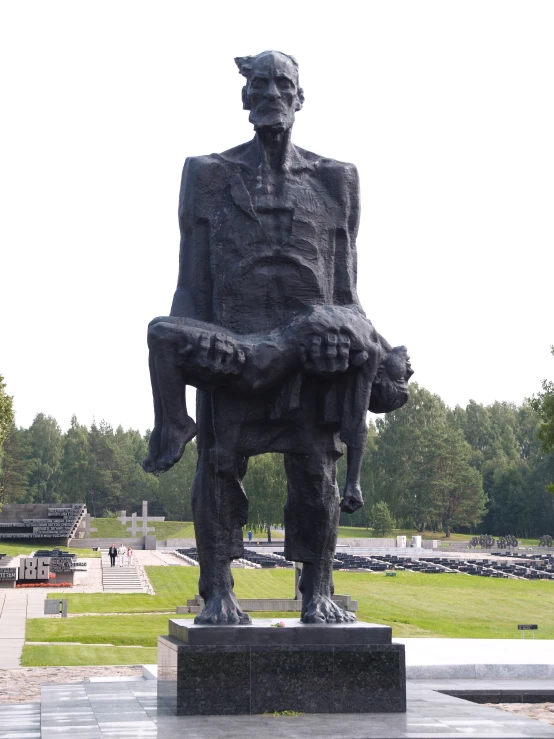 a large stone statue is on display at the park