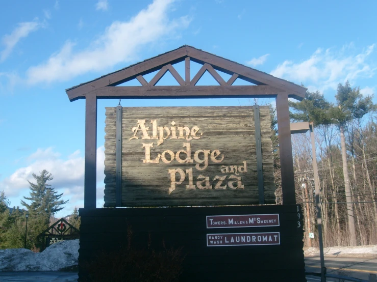 a large wooden sign for a pizza business