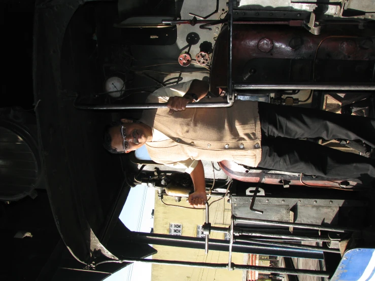 a person standing in front of a train engine