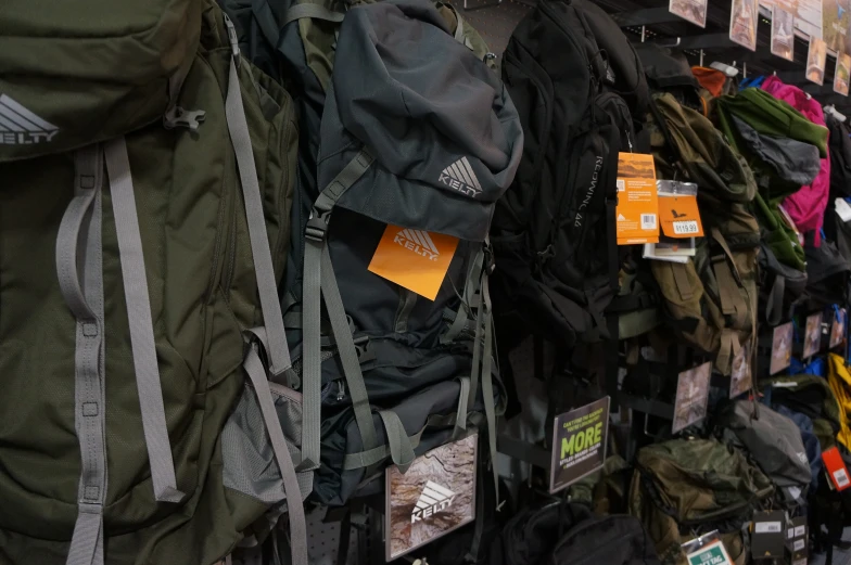 backpacks and jackets on display in a store