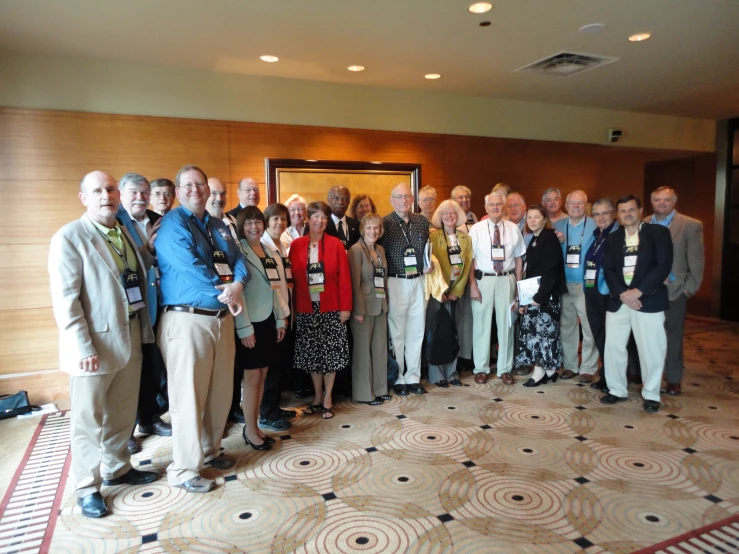 a group of people standing together in a lobby