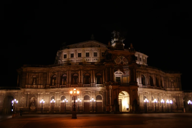 an elaborate building lit up at night time