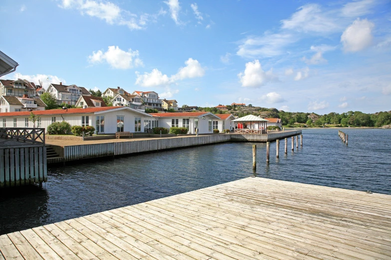 there is a house next to the water in front of the dock