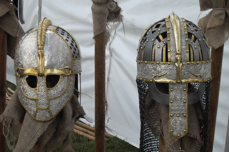 two medieval armor heads, which are displayed
