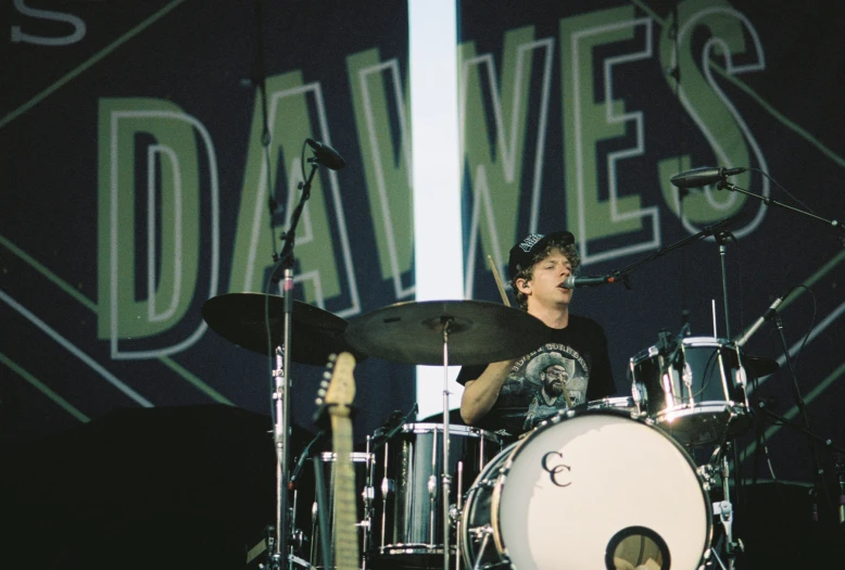 a man is playing drums at the festival