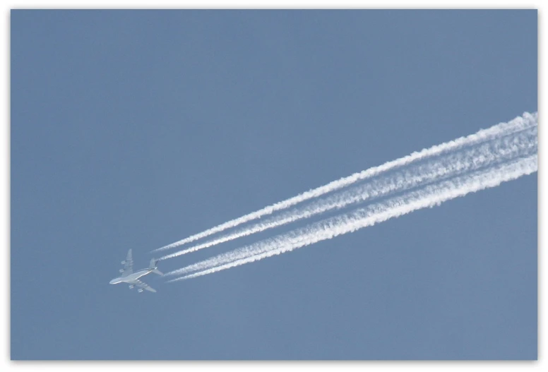 a jet airplane that is flying through the sky