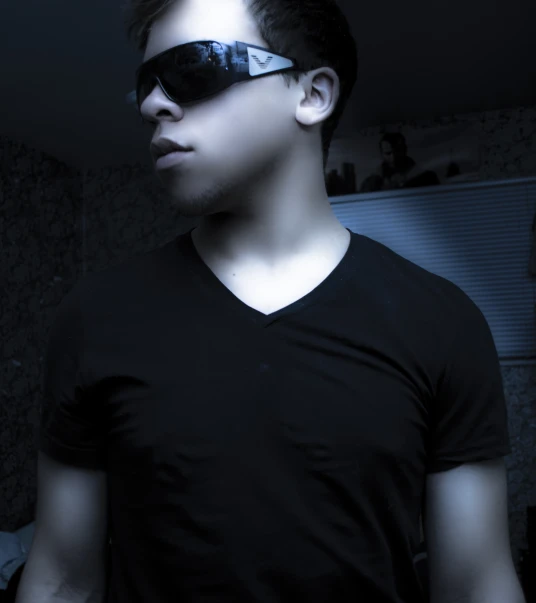 a man with a pair of dark shades on