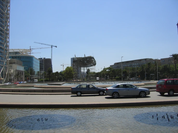 an open parking lot with several cars parked near one another