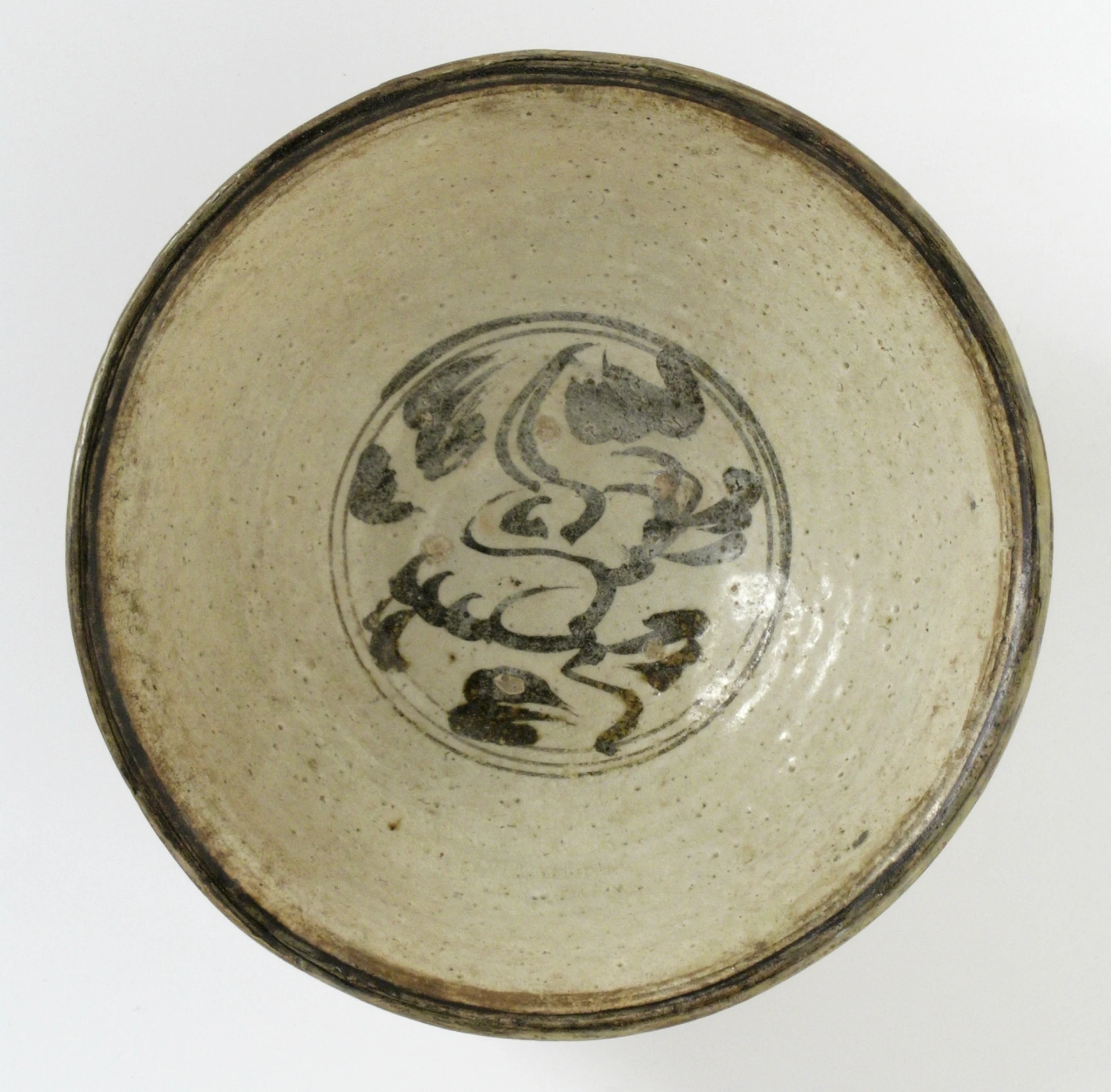 a bowl with animal images in white over a grey background