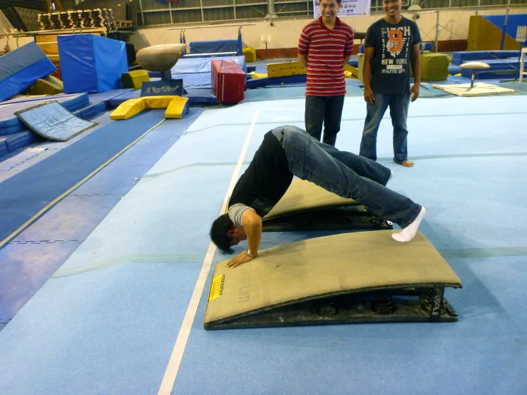 young people in the middle of a obstacle course with an adult