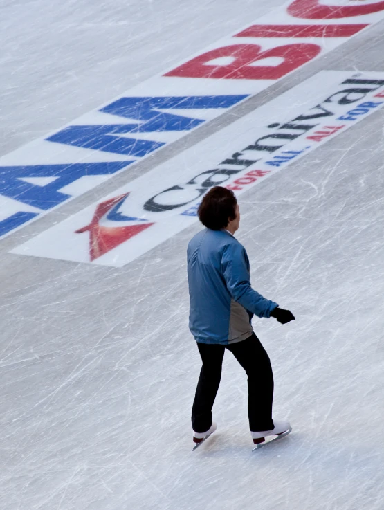 a man is skating around on the ice