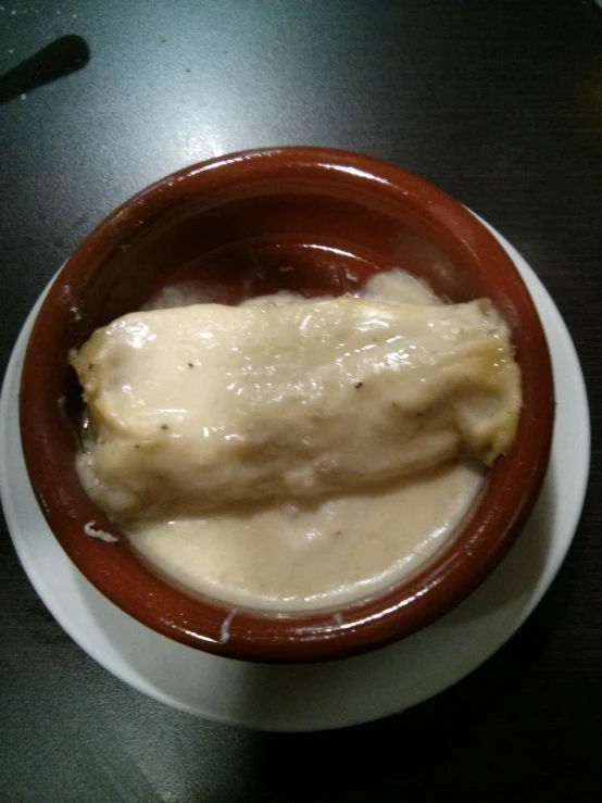 food in a bowl with a small spoon