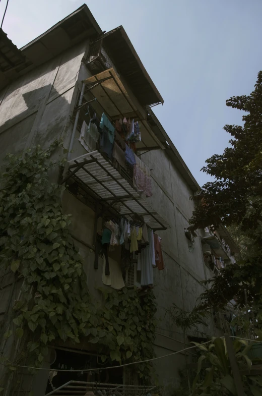 several people on a balcony, one in the air