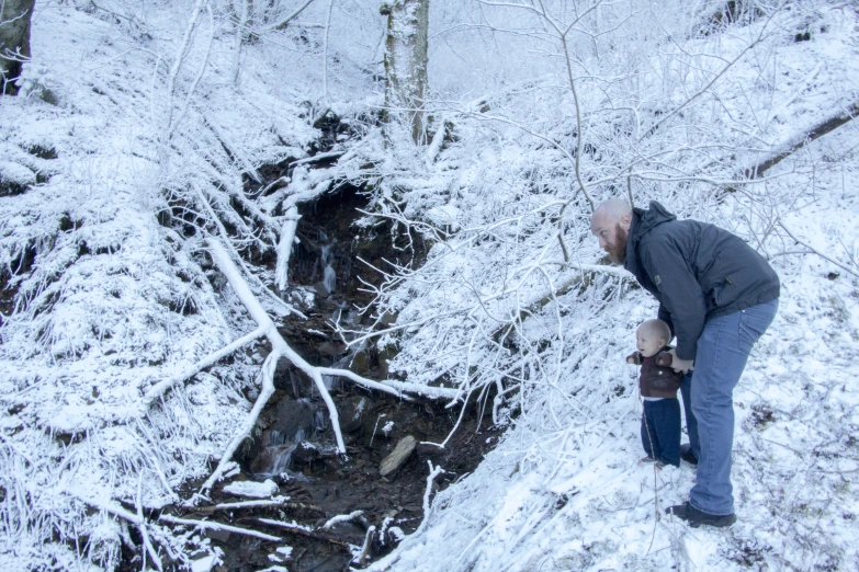 a man is looking at a snowy scene