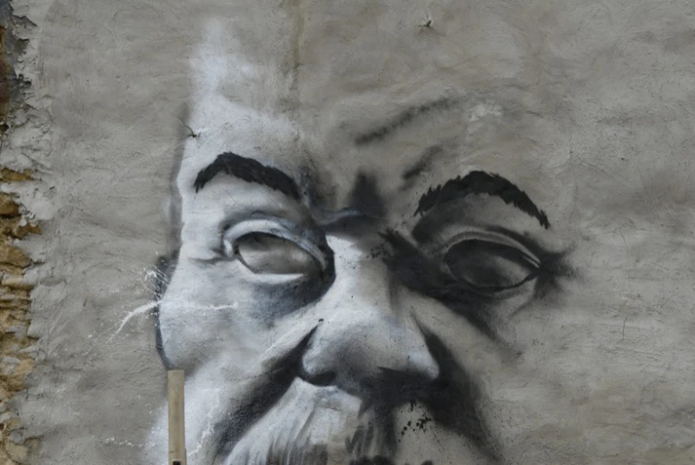 a face painted on the side of a building