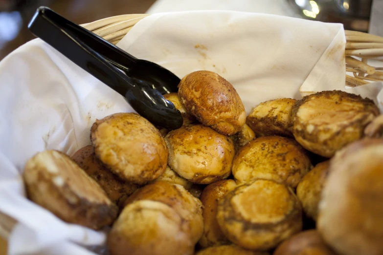 there is a basket full of breaded potatoes