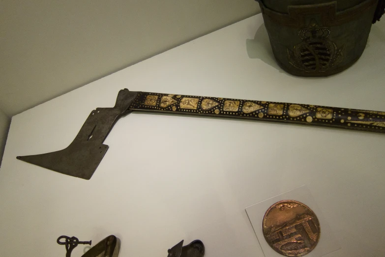 a knife and other items sit on display