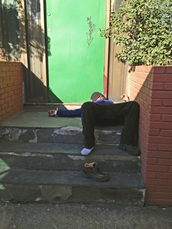 a man laying down on some steps