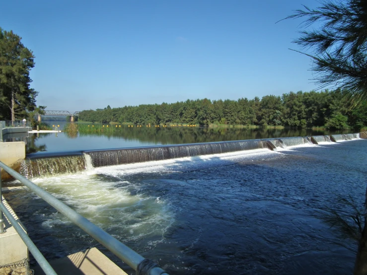 an image of water running from the dam into the river