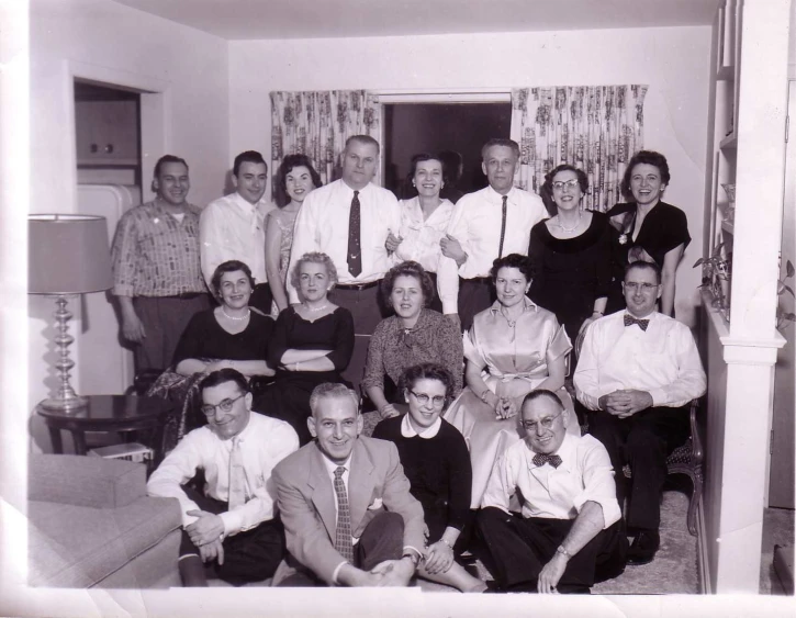 a black and white pograph of a group of people standing