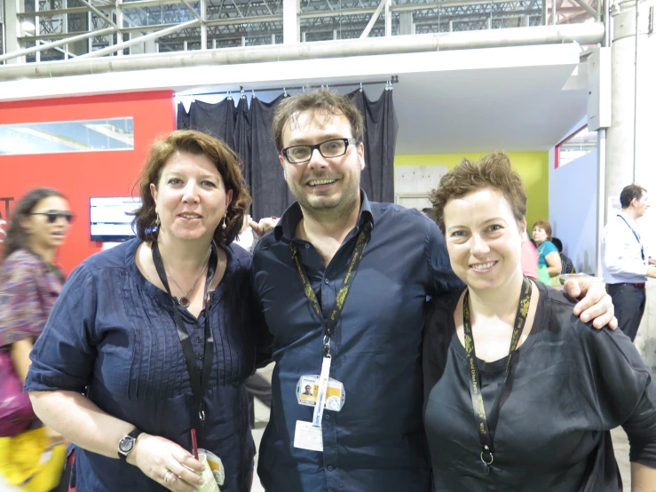 two women, a man and a woman posing for a picture