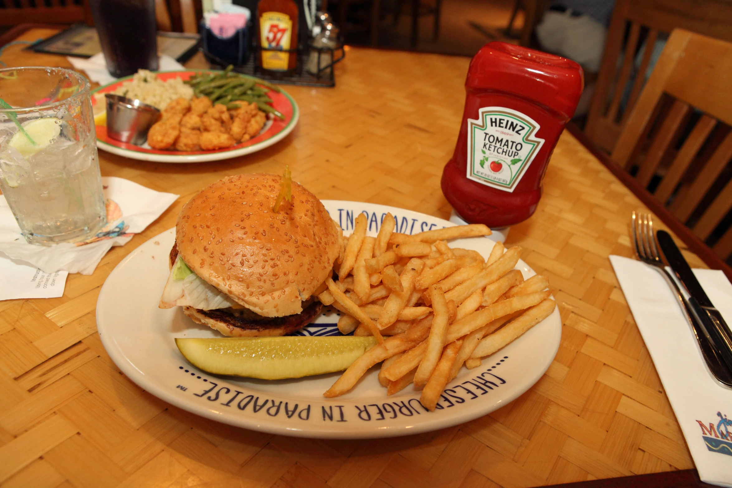 plate with sandwich and fries, pickle and ketchup on the side