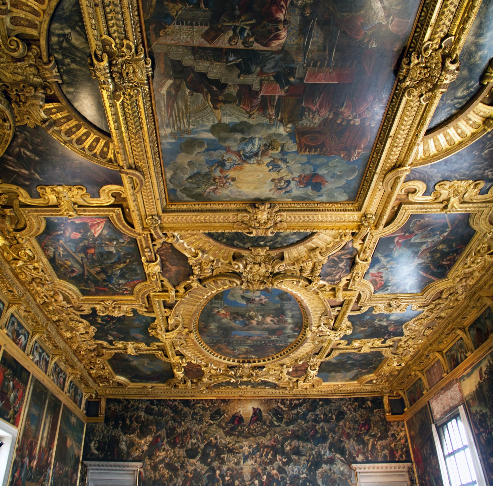 fancy, gold painted room with ornately decorated ceiling