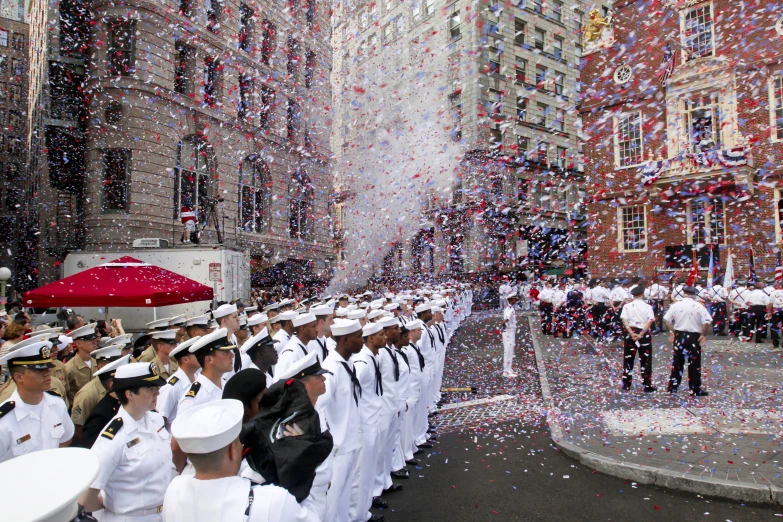 there are military men and women in uniform that are being thrown from the ceiling