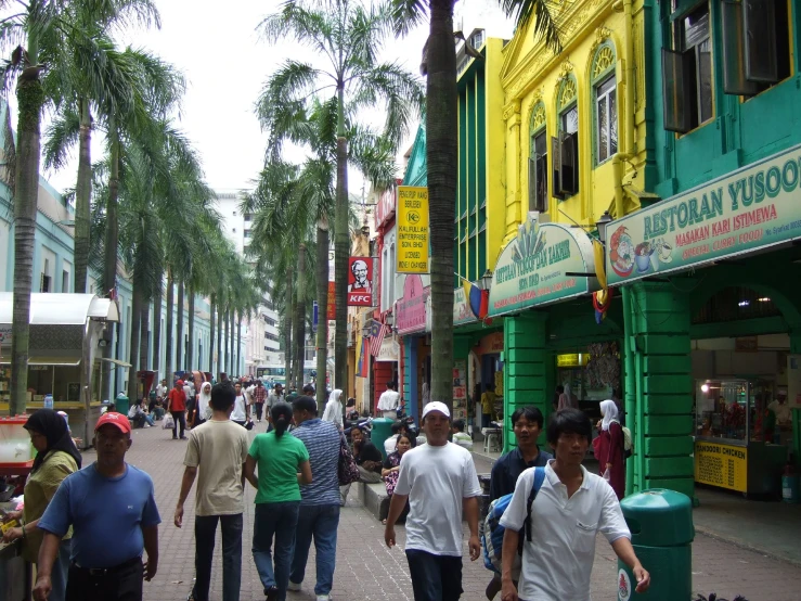 the people are walking down the street together