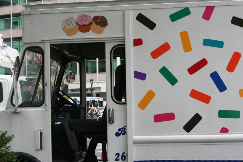 a white truck with multi colored windows decorated