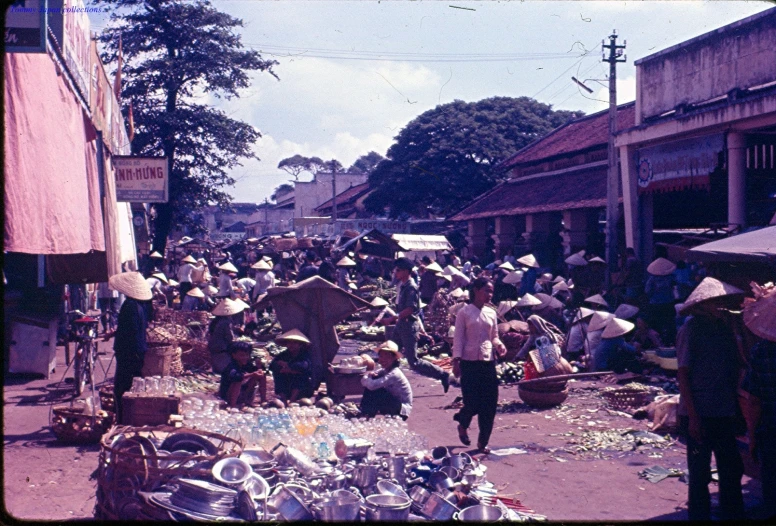 the crowded street is full of people and vendors