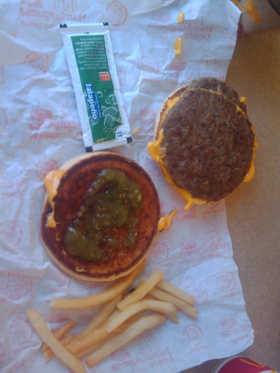 a hamburger and fries on the table