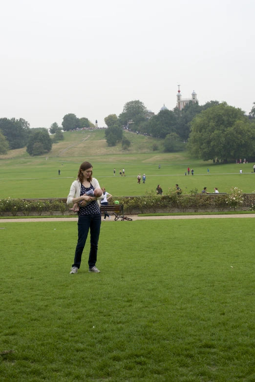 a person on some grass playing with a frisbee