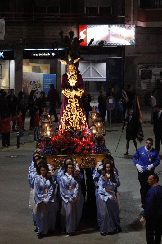 several people standing in the middle of a parade