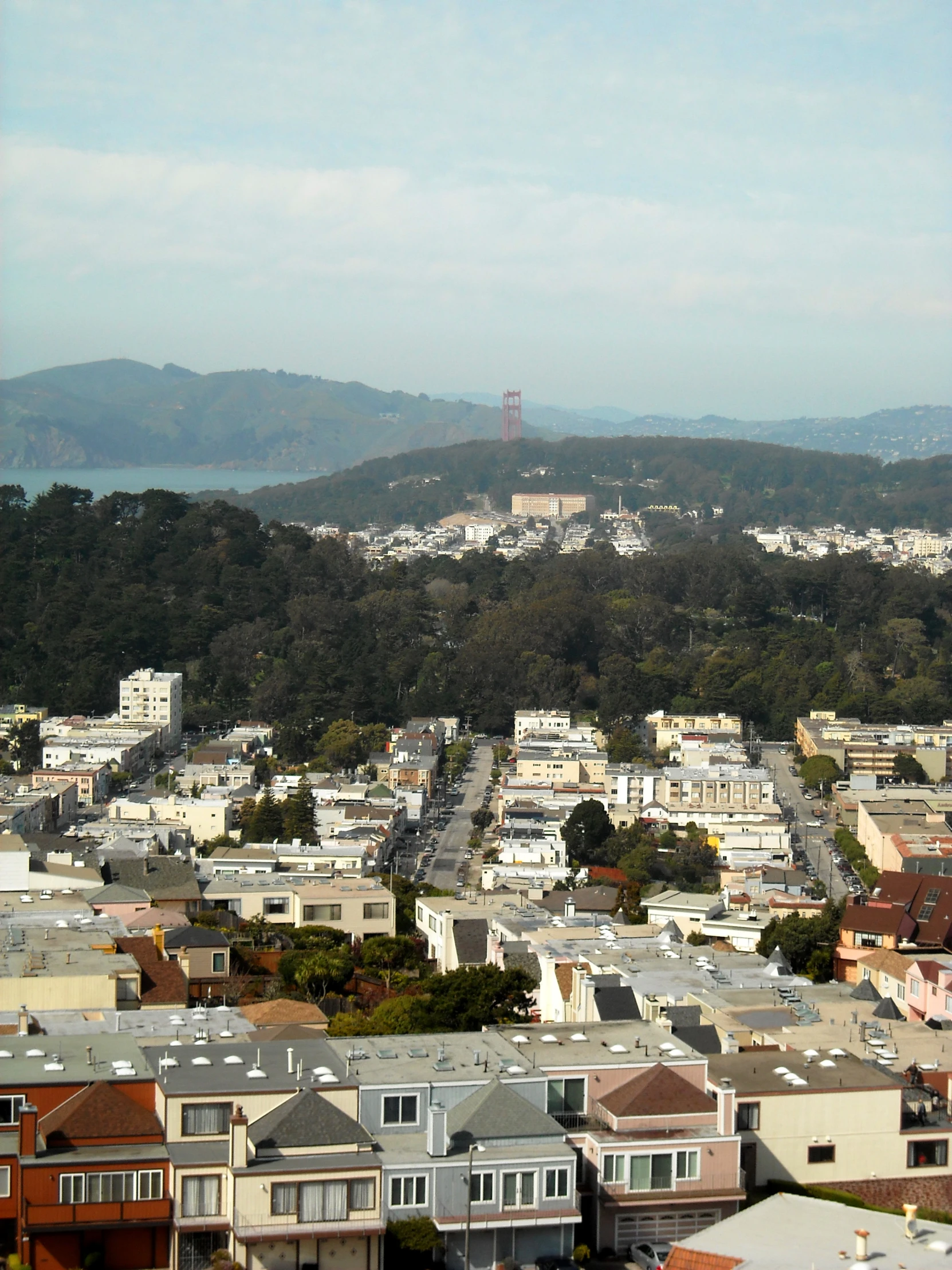 view of a city with a hill in the background