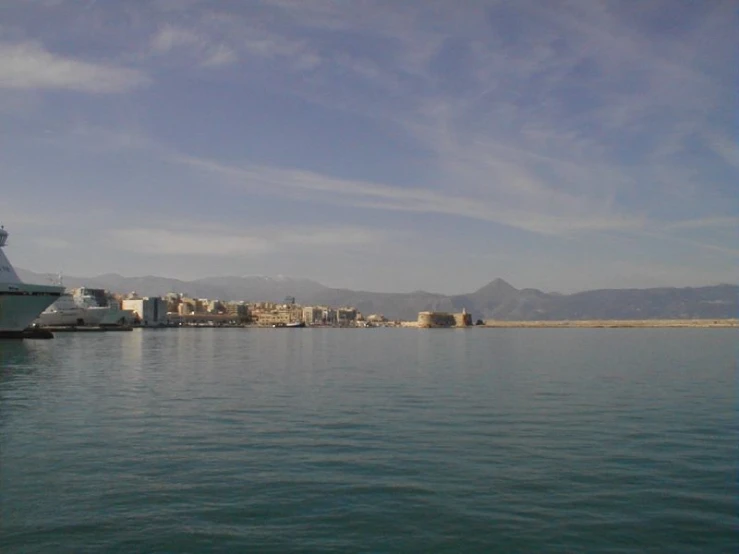 a large cruise ship traveling through a city on water