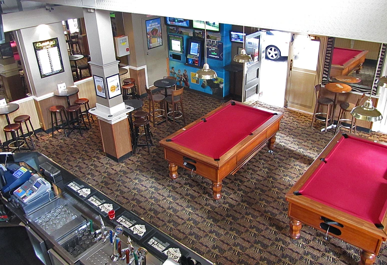 a two - level view of tables, stools and other items