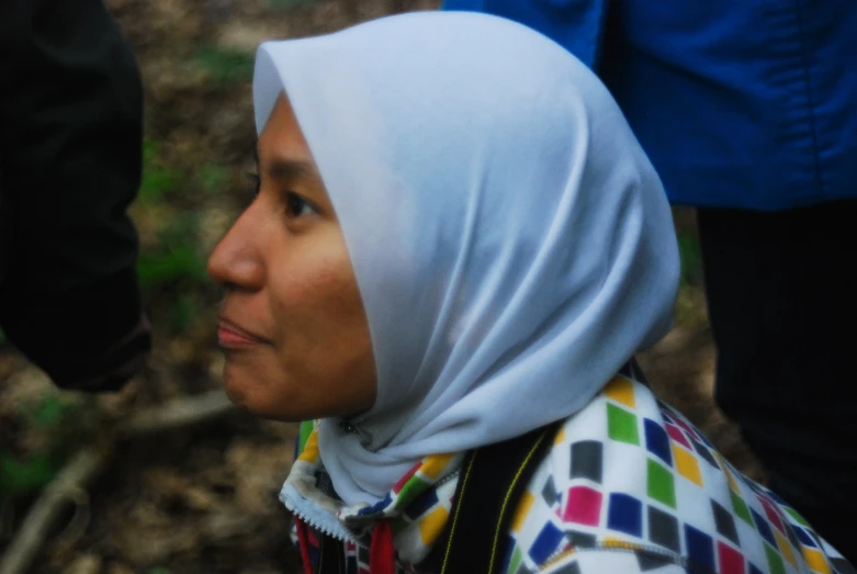 a woman wearing a white scarf on her head