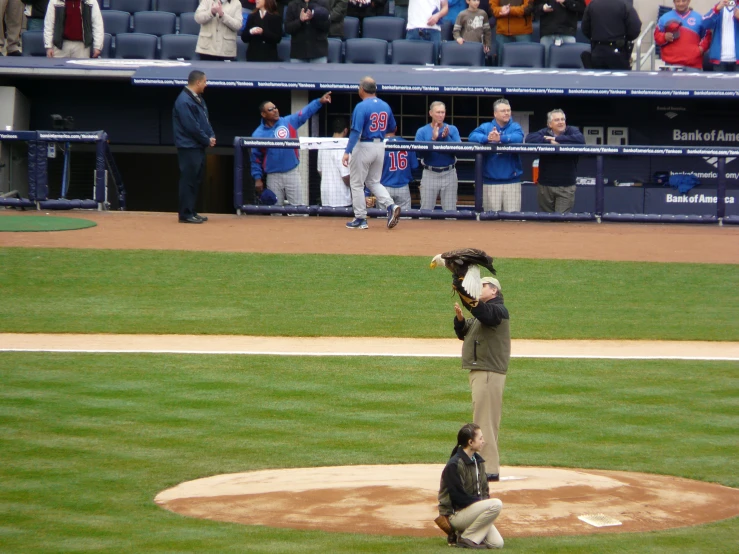 a couple of men on a field with baseball bats